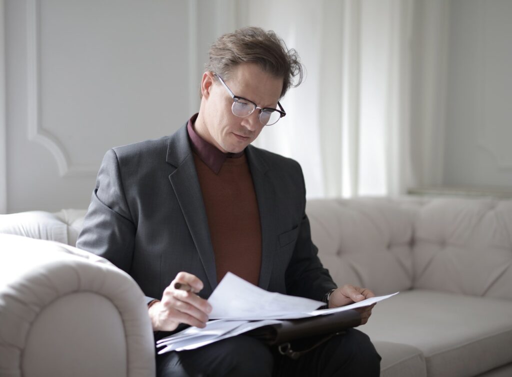 man reading documents